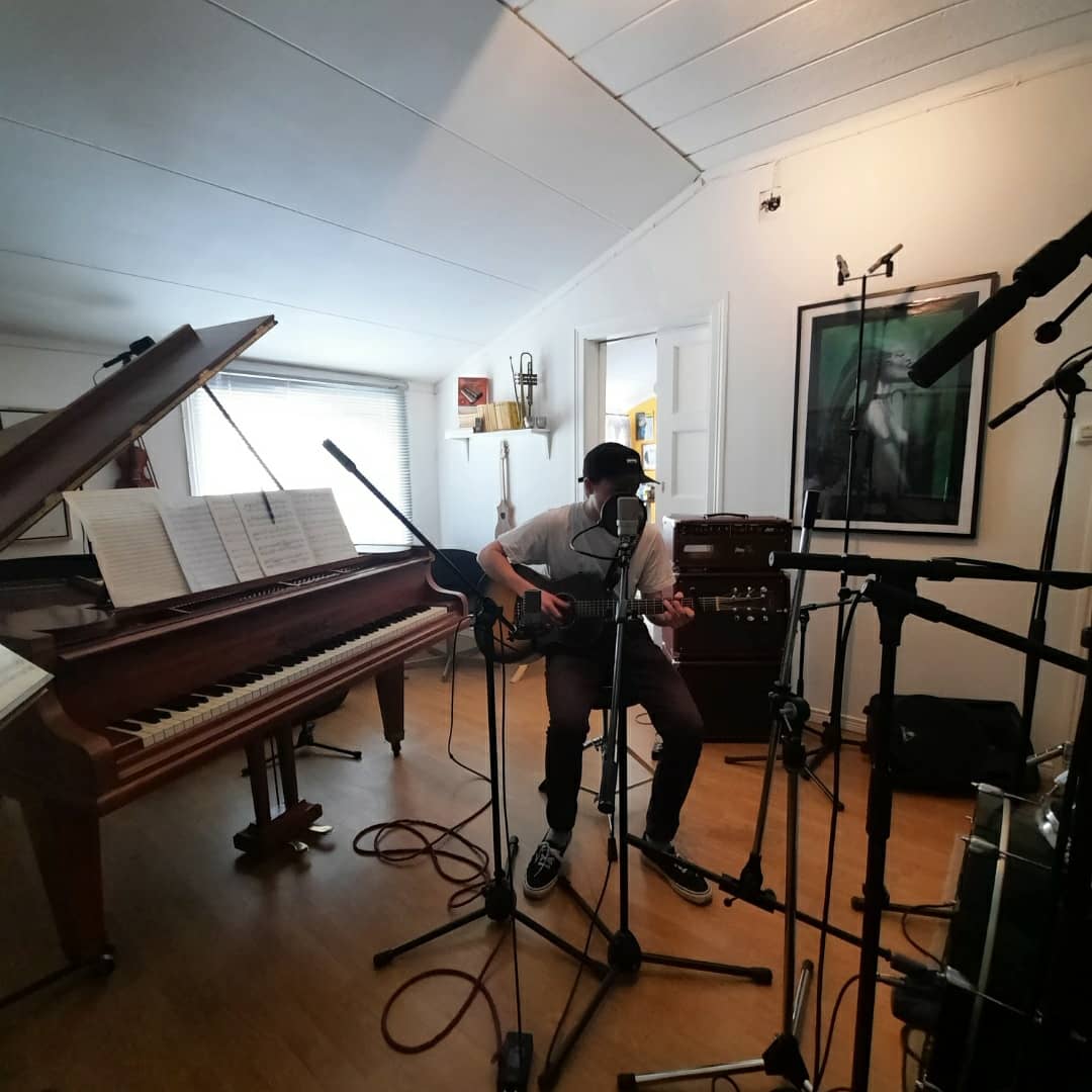 Tempo Studio control room with ambient purple lighting