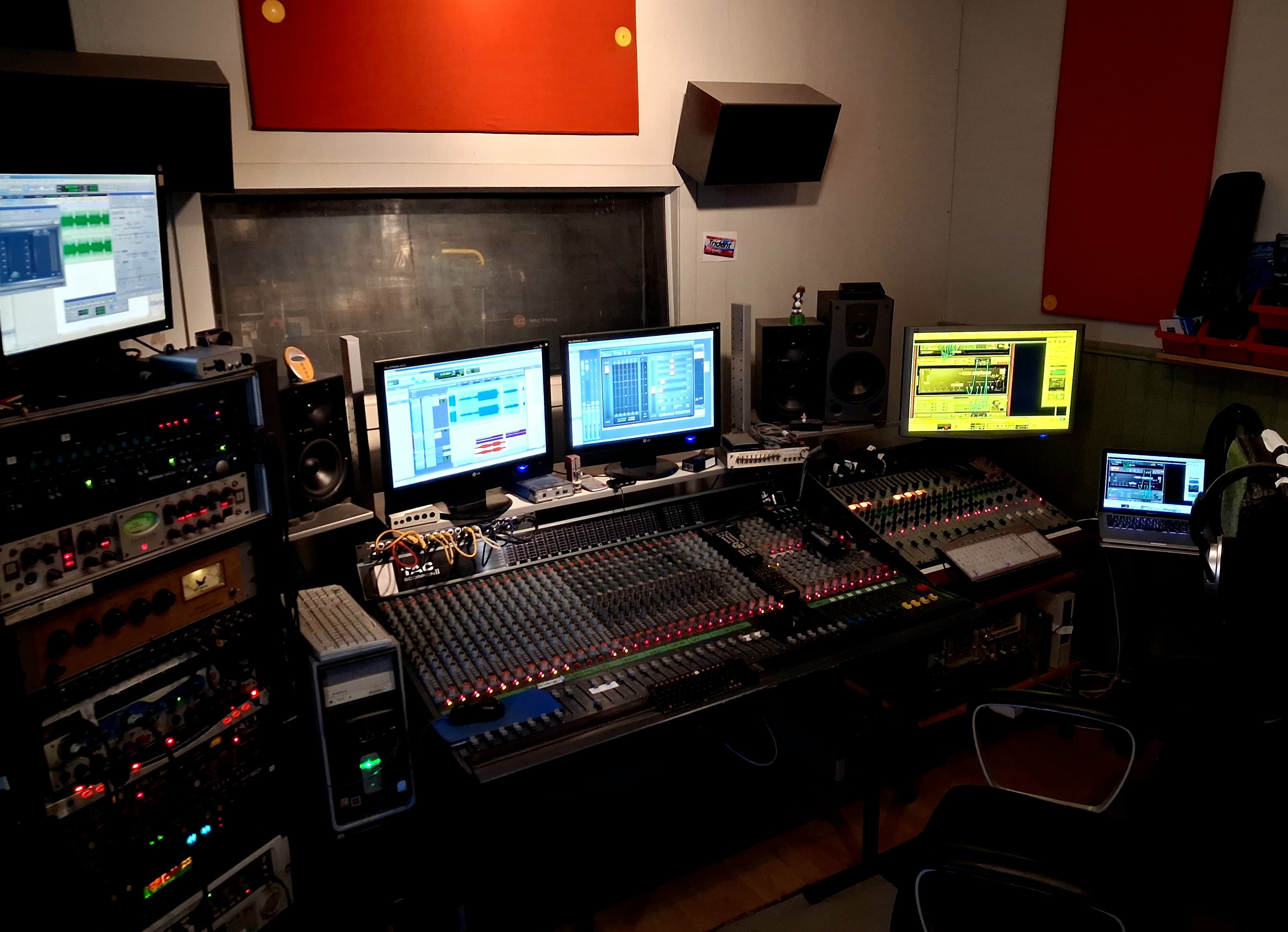 Tempo Music Studio — purple-lit mixing console